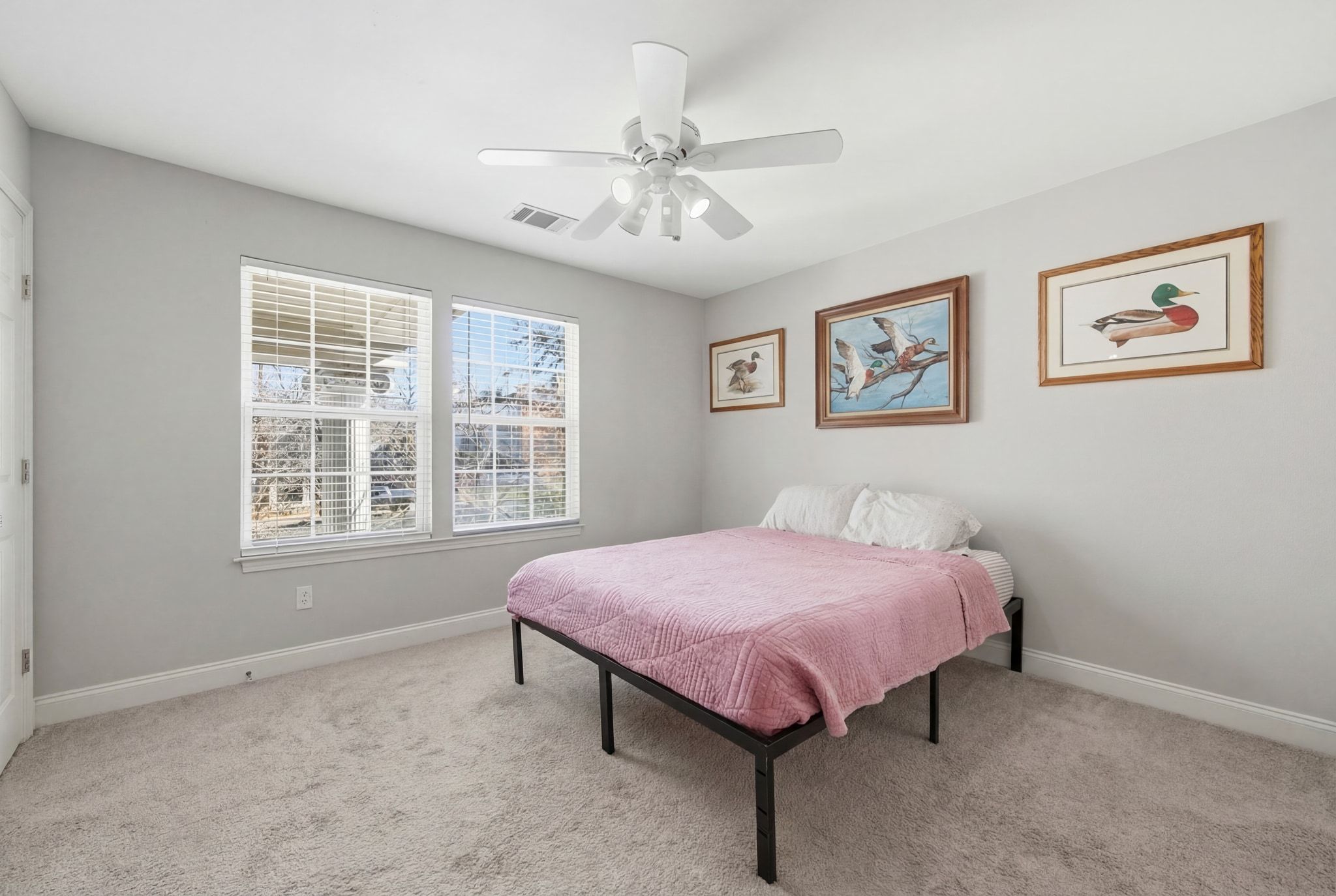 2413 Enfield Road Austin, TX 78703 - Photo 21 of 38 a spacious bedroom with a bed and a window