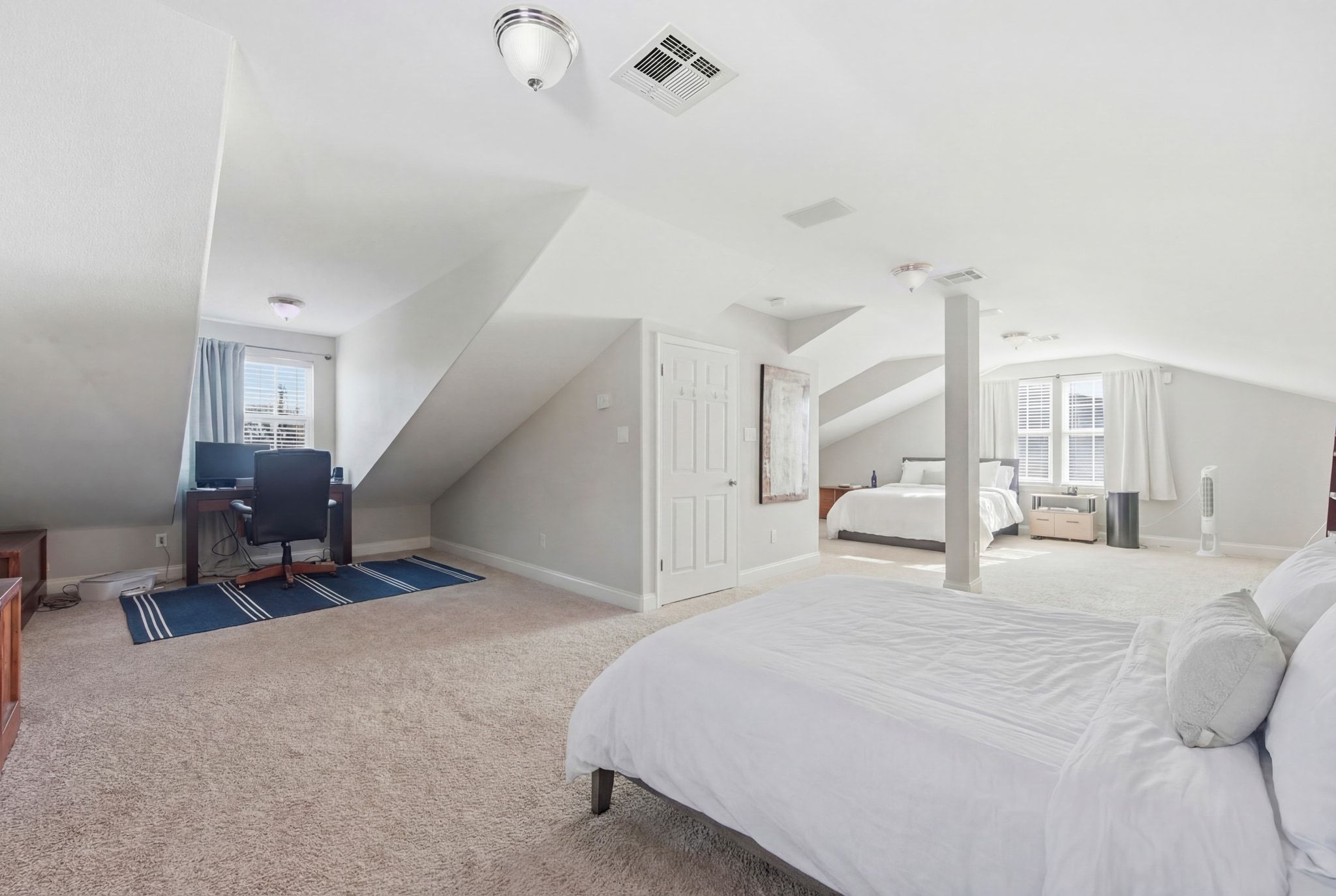 2413 Enfield Road Austin, TX 78703 - Photo 24 of 38 a large white bed in a white room