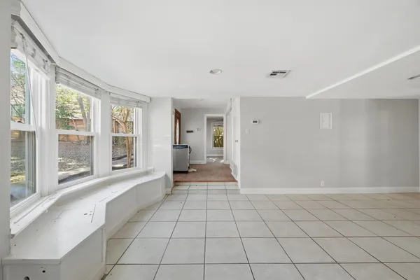 a view of an empty room and window