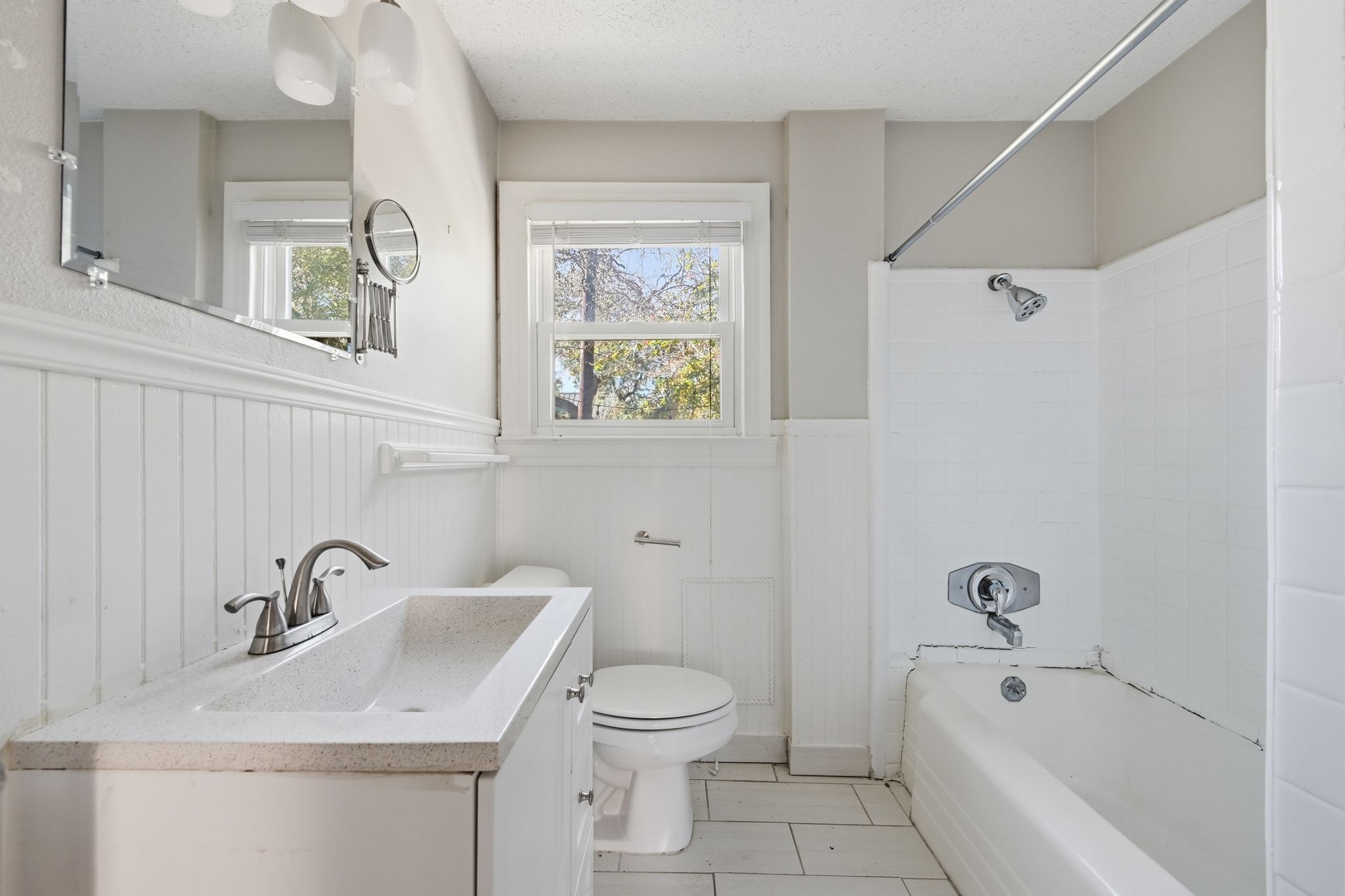 2413 Enfield Road Austin, TX 78703 - Photo 32 of 38 a bathroom with a sink a toilet and a bathtub