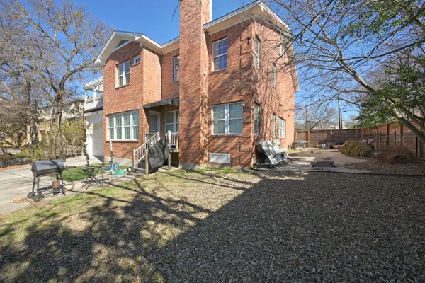 a view of a street with a building in the background