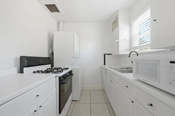 a kitchen with a stove and a sink