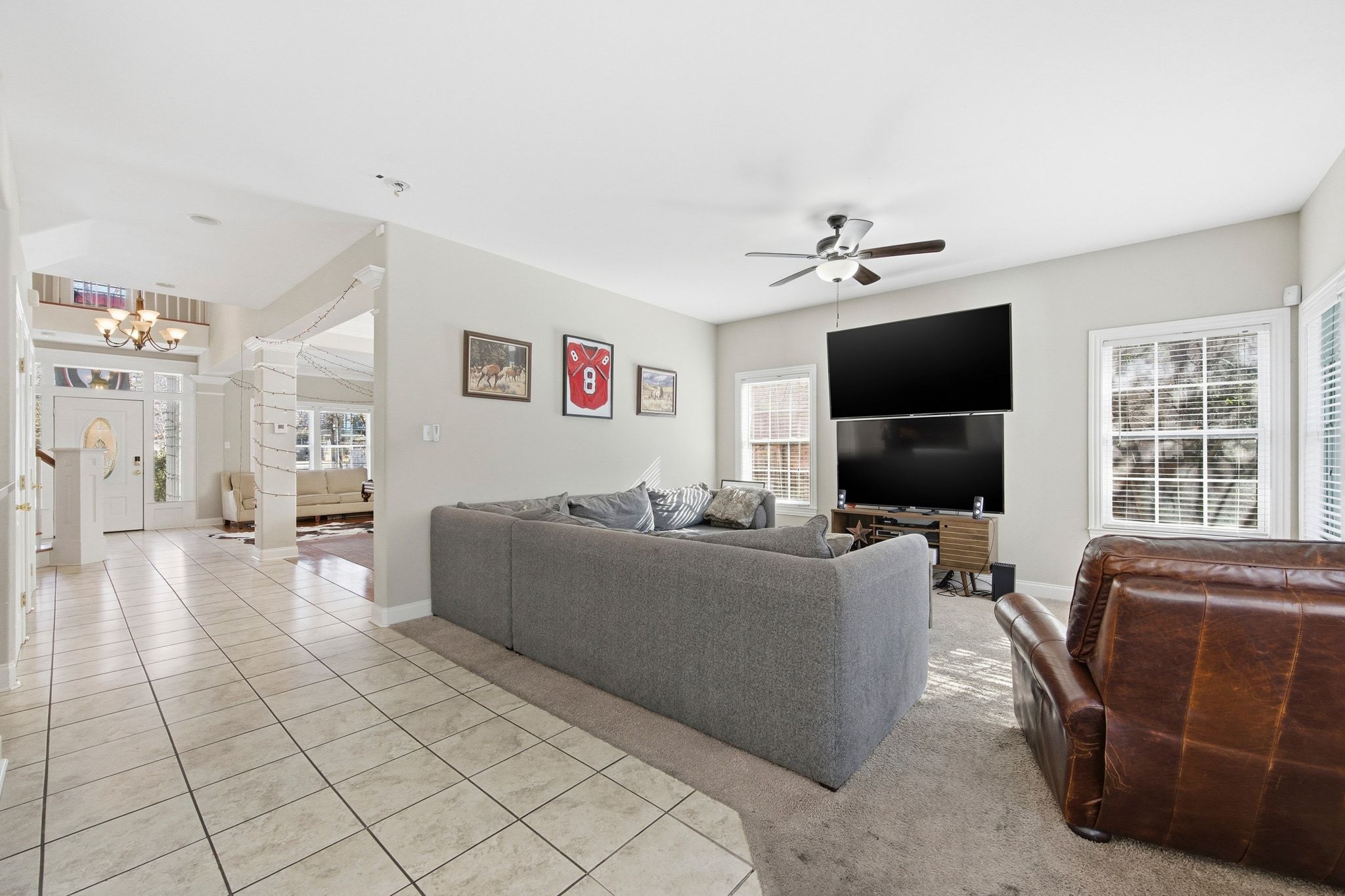 2413 Enfield Road Austin, TX 78703 - Photo 5 of 38 a living room with furniture and a flat screen tv