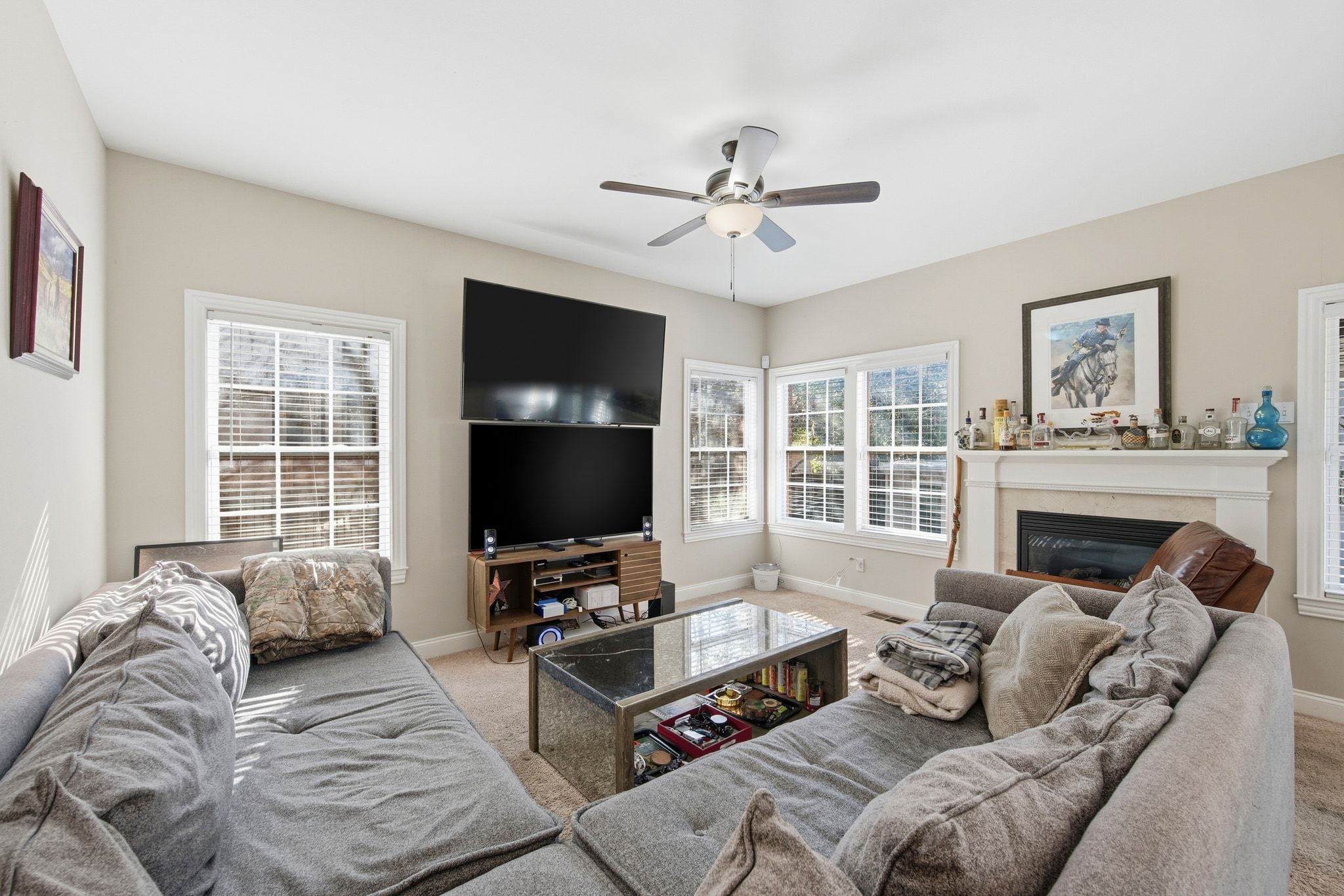 2413 Enfield Road Austin, TX 78703 - Photo 6 of 38 a living room with furniture a flat screen tv and a fireplace