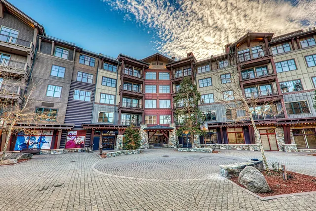 a front view of a brick building with many windows