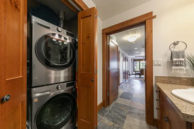 a view of a hallway with washer and dryer