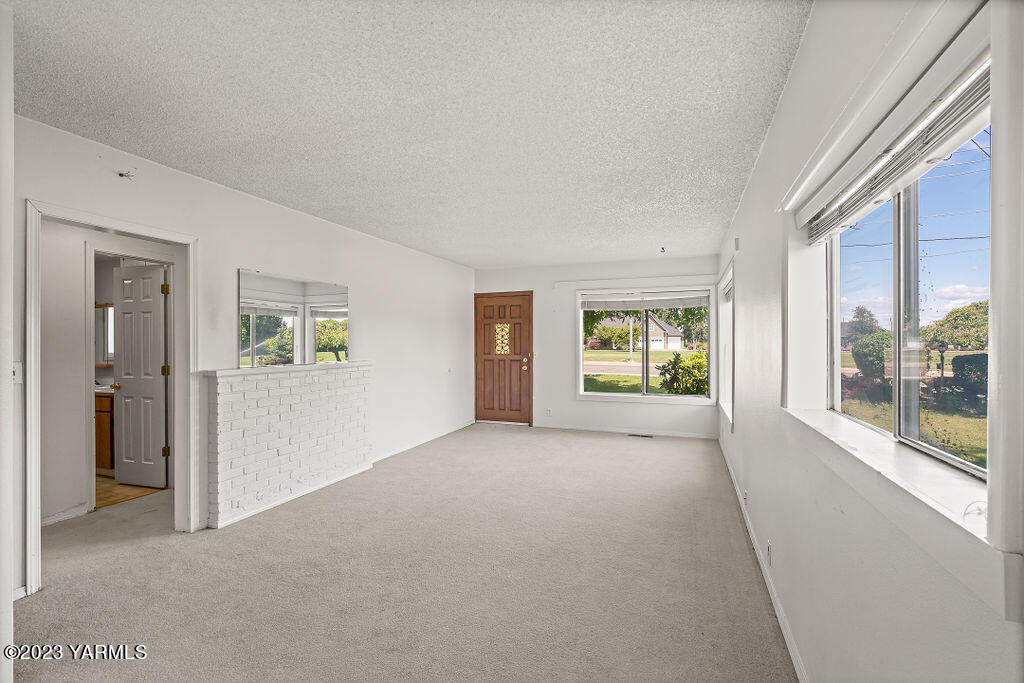 9206 Occidental Road Yakima, WA 98903 - Photo 6 of 23 a view of empty room with windows