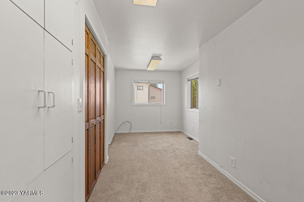 9206 Occidental Road Yakima, WA 98903 - Photo 9 of 23 a view of an empty room with a window