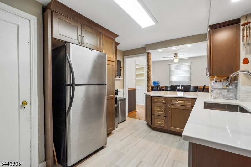 267 Kings Road Madison, NJ 07940 - Photo 9 of 37 a kitchen with stainless steel appliances granite countertop a refrigerator a stove and a sink