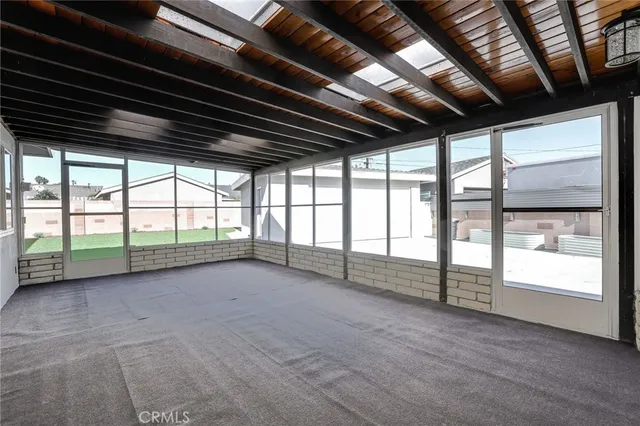 a view of an empty room with a balcony