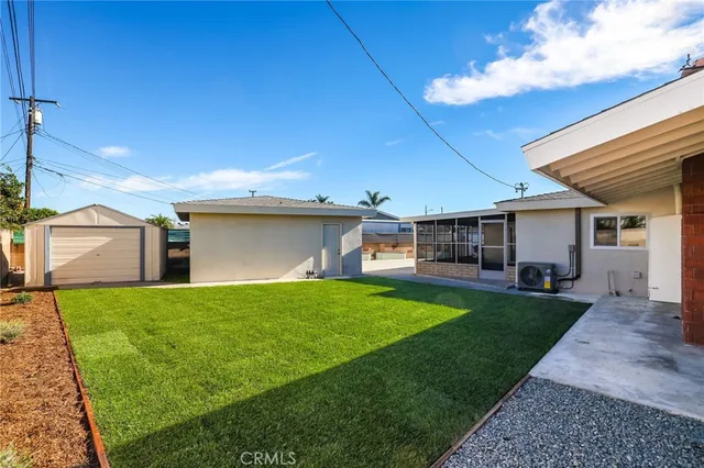 a view of a backyard of the house