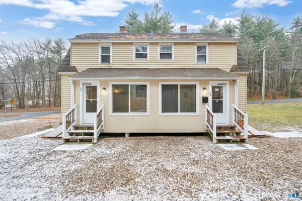 a view of a house with a yard