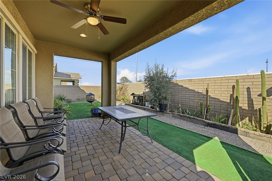 250 Dedication Avenue Henderson, NV 89011 - Photo 40 of 67 Fenced backyard with ceiling fan and a patio area