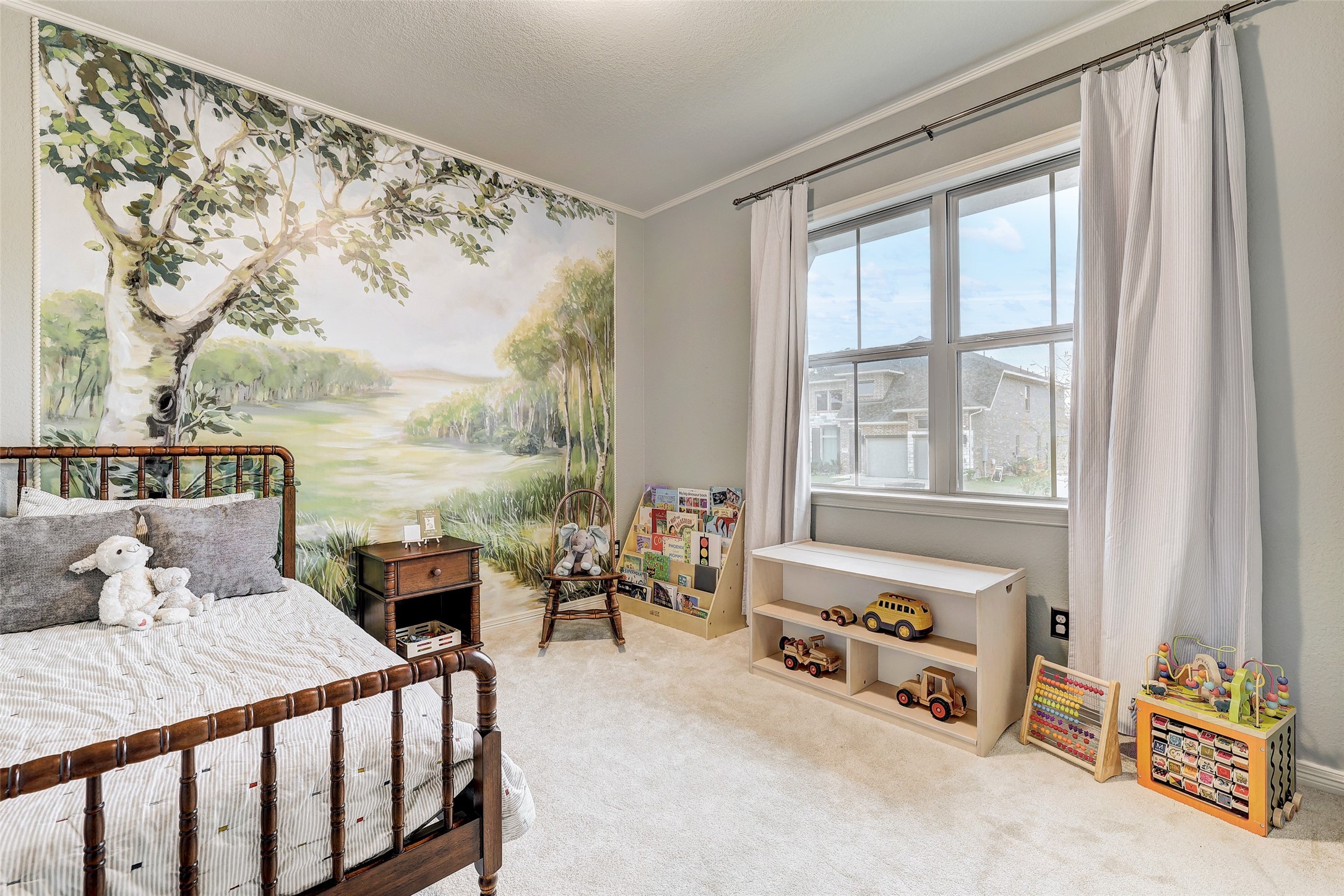 1117 Spring Gulch Lane Georgetown, TX 78628 - Photo 28 of 39 A tranquil bedroom with a captivating landscape mural wall and soft carpeting offers a peaceful retreat.