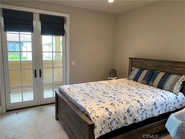 a bathroom with a sink a toilet and a window