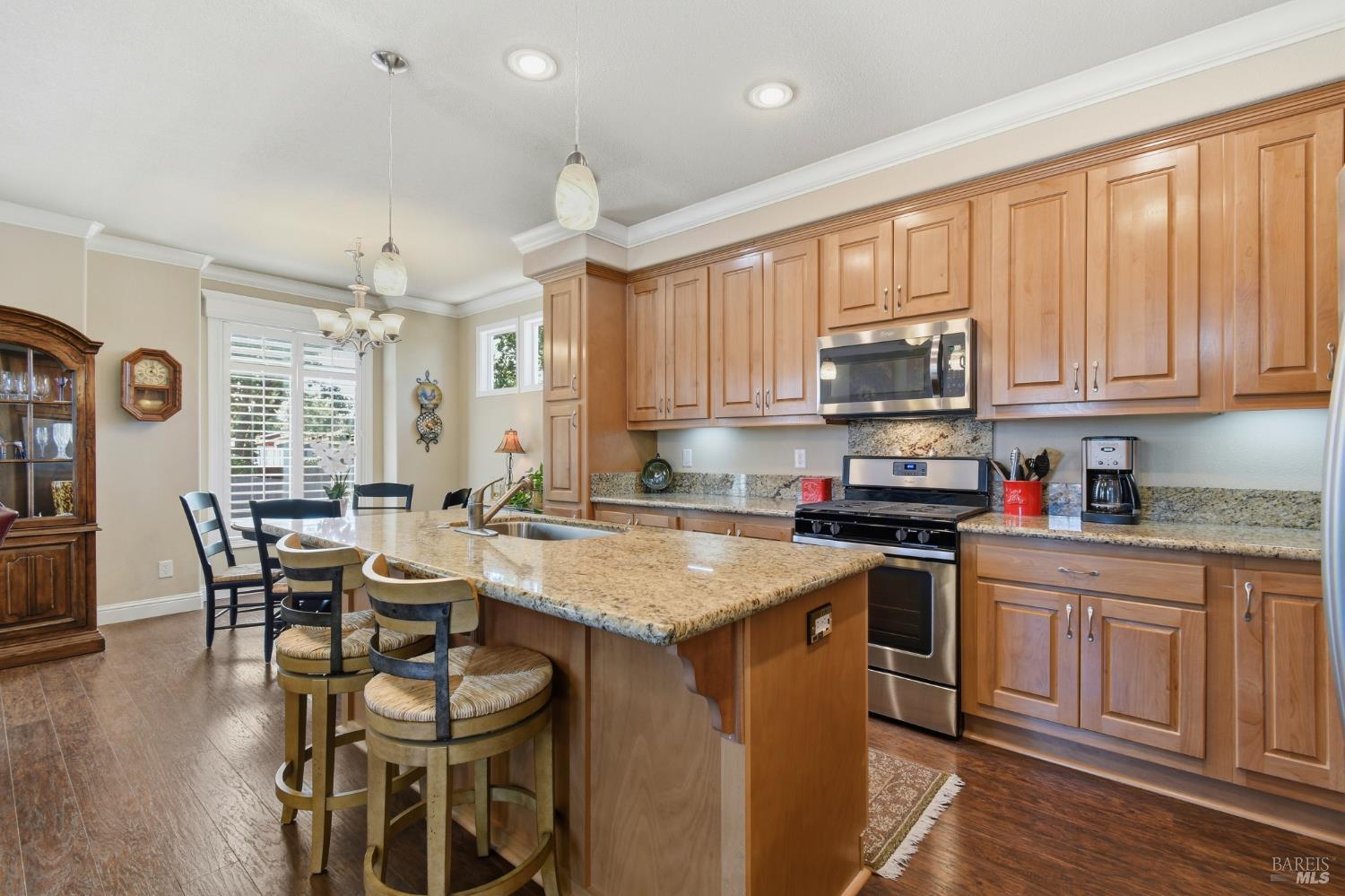 120 Shamrock Circle Santa Rosa, CA 95403 - Photo 19 of 45 a kitchen with a table chairs stove and cabinets
