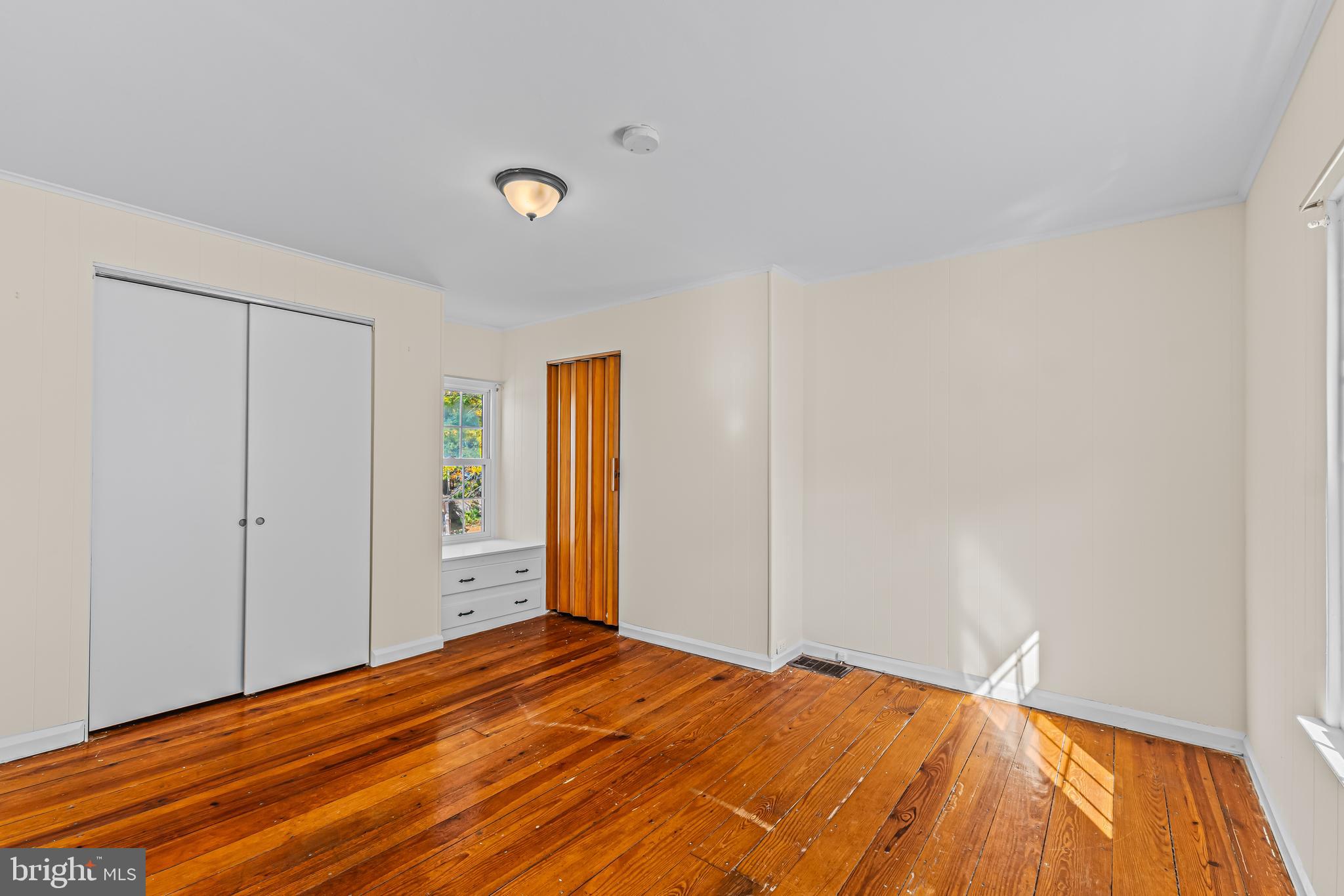 14 Church Street Chesterfield, NJ 08515 - Photo 17 of 25 a view of empty room with wooden floor and fan