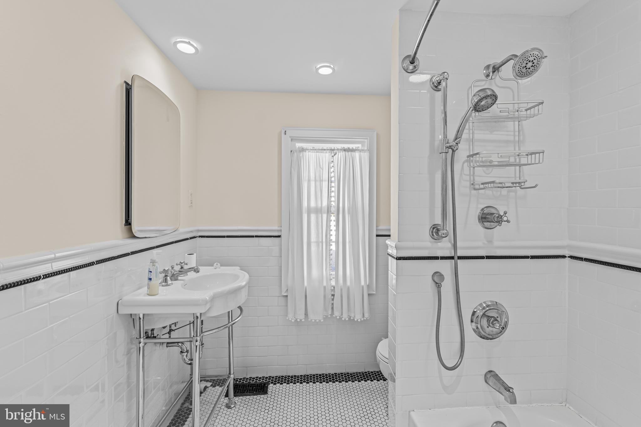 14 Church Street Chesterfield, NJ 08515 - Photo 19 of 25 a bathroom with a sink a mirror and shower