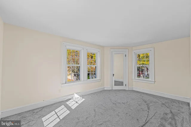a kitchen with sink cabinets and wooden floor