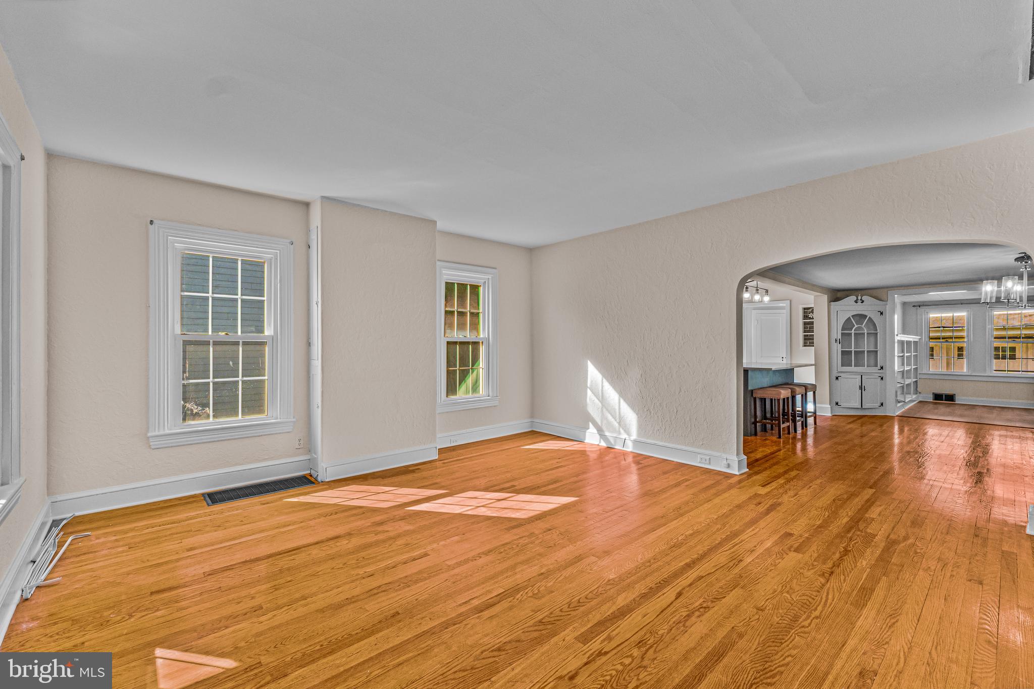 14 Church Street Chesterfield, NJ 08515 - Photo 4 of 25 a view of empty room with wooden floor and floor to ceiling window