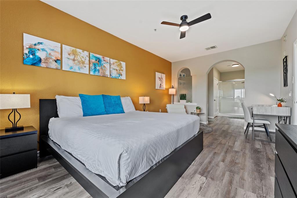 14200 Avalon Road, Unit 409 Winter Garden, FL 34787 - Photo 16 of 33 a bedroom with bed and wooden floor
