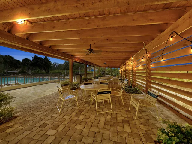 a patio with table and chairs