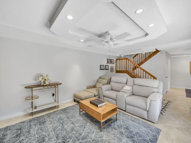 a living room with furniture and a table
