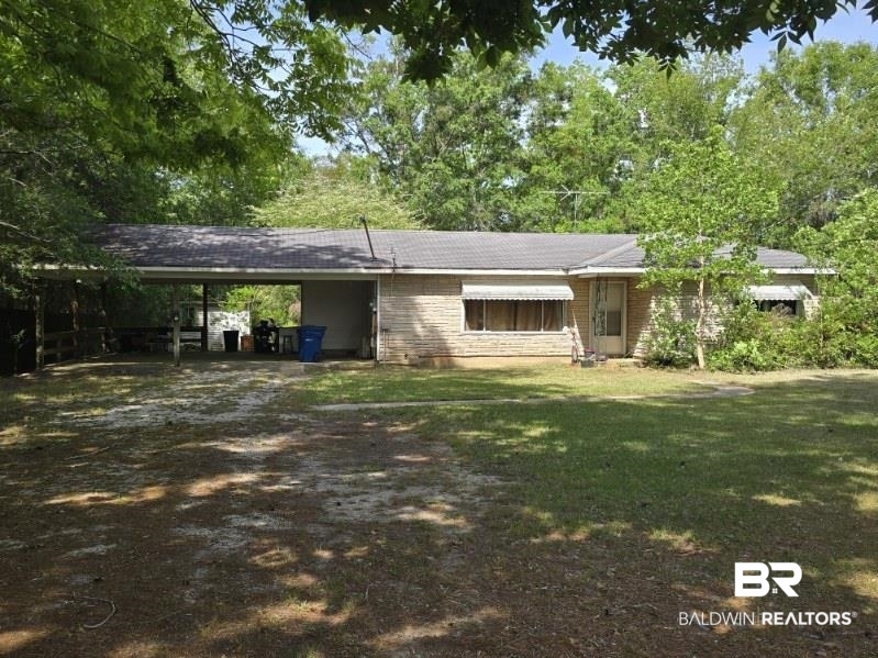 530 Rockaway Creek Road Atmore, AL 36502 - Photo 1 of 2 View of front of house featuring a carport, a front lawn, and driveway