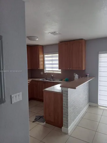 a kitchen with a cabinets and a sink