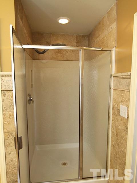 1505 Autumn Ridge Drive Durham, NC 27712 - Photo 17 of 25 a bathroom with a glass shower door
