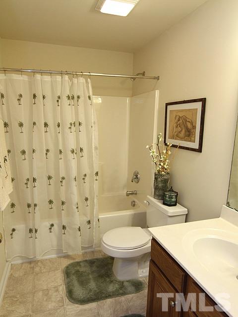 1505 Autumn Ridge Drive Durham, NC 27712 - Photo 20 of 25 a bathroom with a sink a toilet and shower