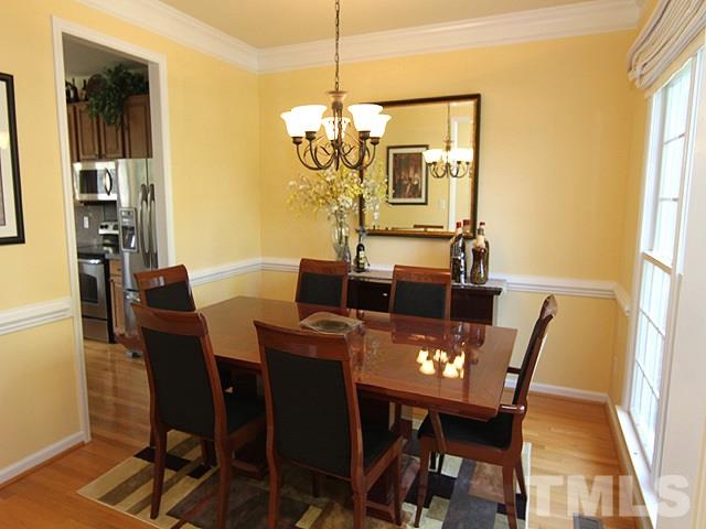1505 Autumn Ridge Drive Durham, NC 27712 - Photo 3 of 25 a view of a dining room with furniture window and wooden floor