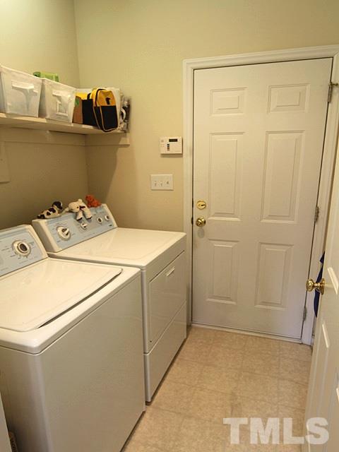 1505 Autumn Ridge Drive Durham, NC 27712 - Photo 22 of 25 a utility room with dryer and washer