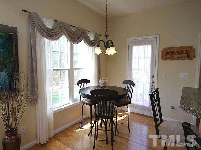 1505 Autumn Ridge Drive Durham, NC 27712 - Photo 8 of 25 a view of a dining room with furniture window and wooden floor