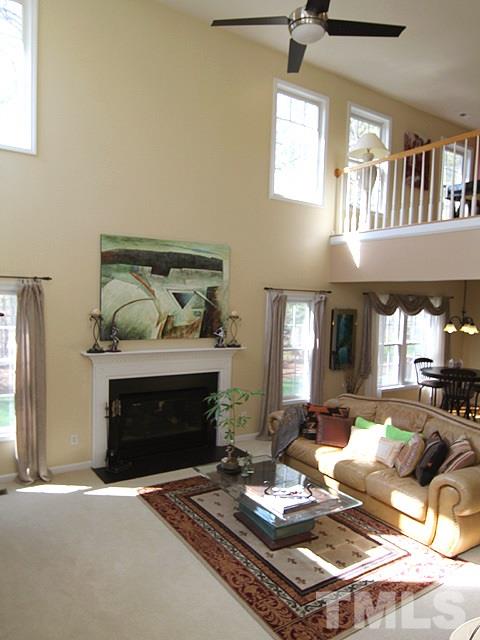 1505 Autumn Ridge Drive Durham, NC 27712 - Photo 10 of 25 a living room with furniture and a fireplace