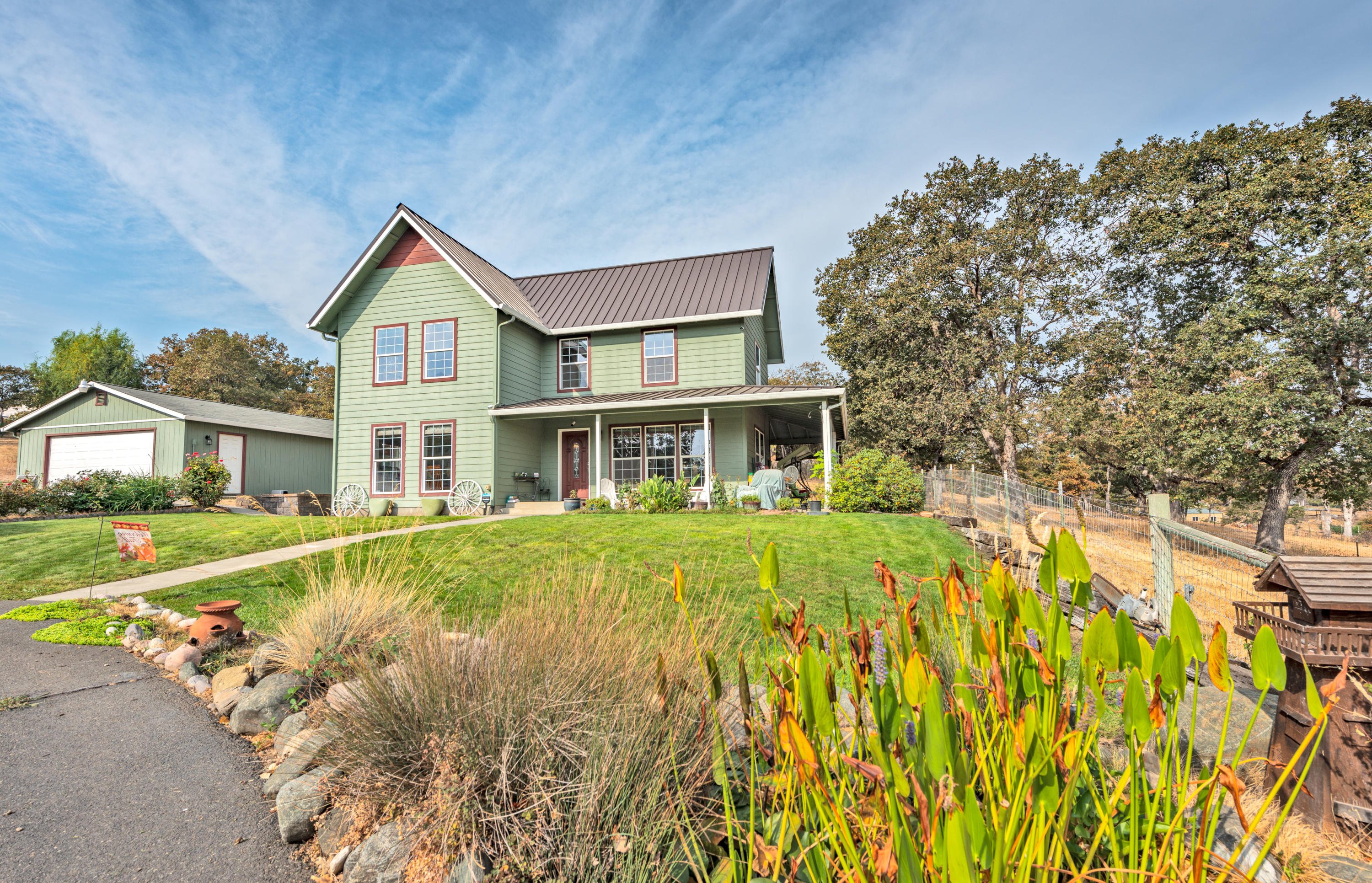 1023 Bigham Brown Road Eagle Point, OR 97524 - Photo 1 of 52 a front view of a house with a yard