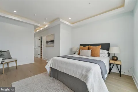 a bedroom with a bed and a chair