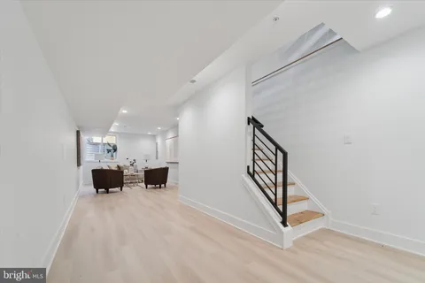 a view of kitchen with cabinets and wooden floor