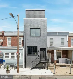 a front view of a building with that has couches