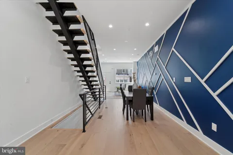 a dining room with furniture and entryway