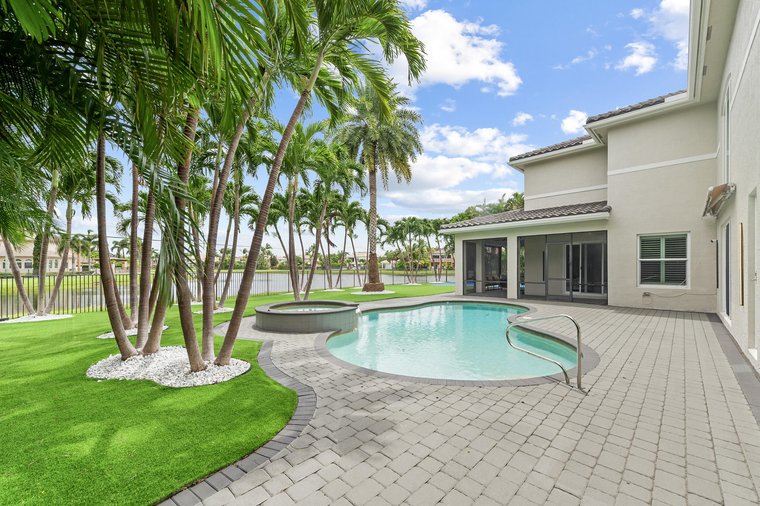 8680 Daystar Ridge Point Boynton Beach, FL 33473 - Photo 16 of 25 a view of a house with a swimming pool