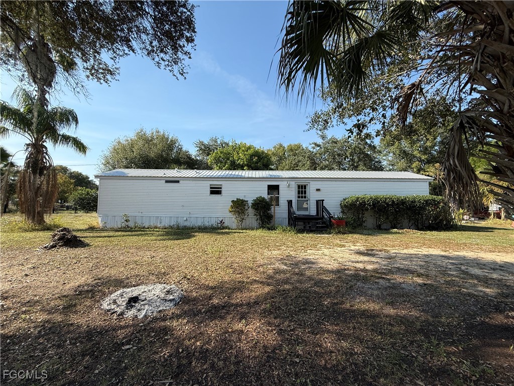 1277 Derby Lane Moore Haven, FL 33471 - Photo 1 of 7 a view of an outdoor space and yard