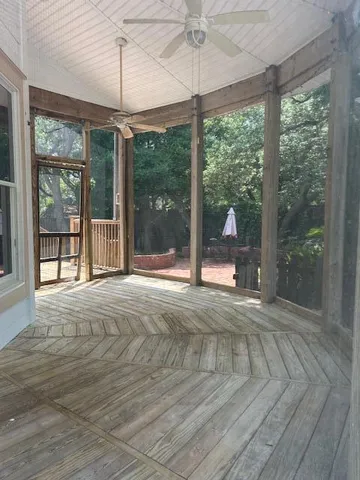 a view of a room with a floor to ceiling window and an outdoor view
