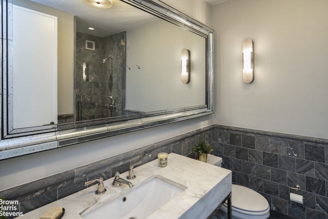 45 East 22nd Street, Unit 42A Manhattan, NY 10010 - Photo 16 of 23 a bathroom with a sink and a mirror