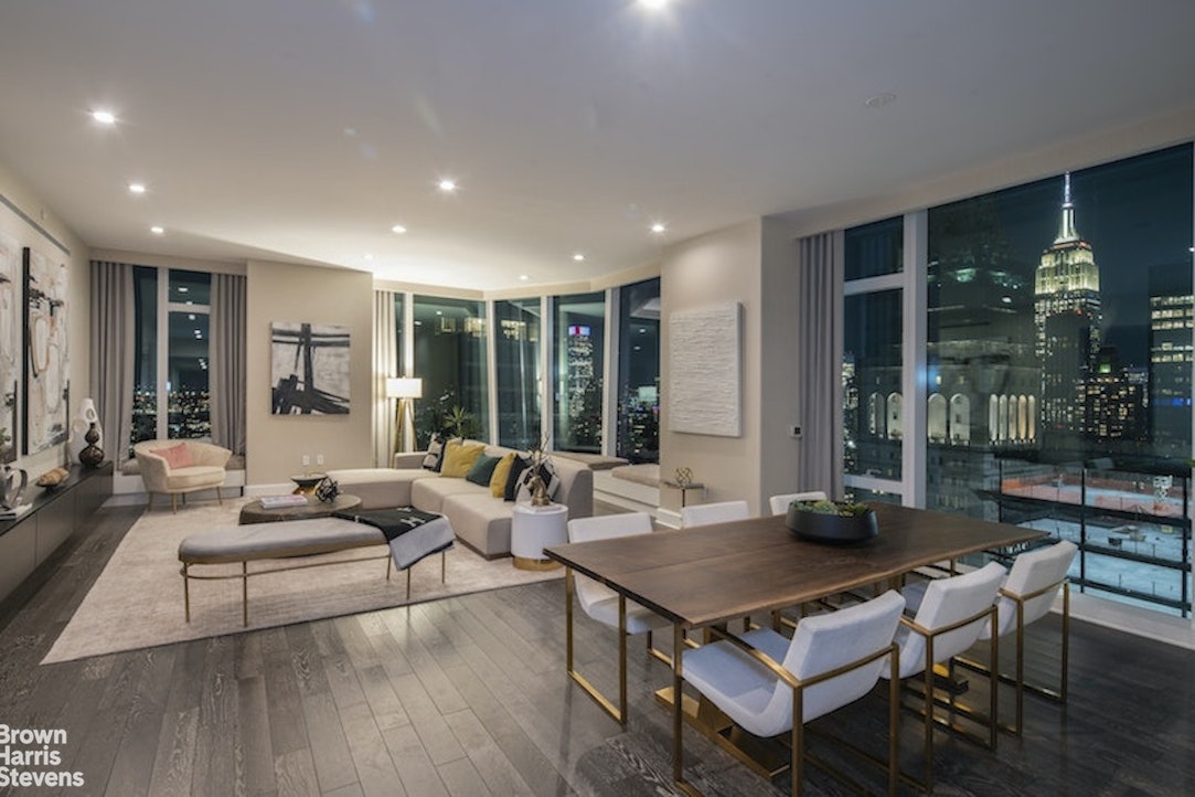 45 East 22nd Street, Unit 42A Manhattan, NY 10010 - Photo 20 of 23 a living room with furniture rug and large window