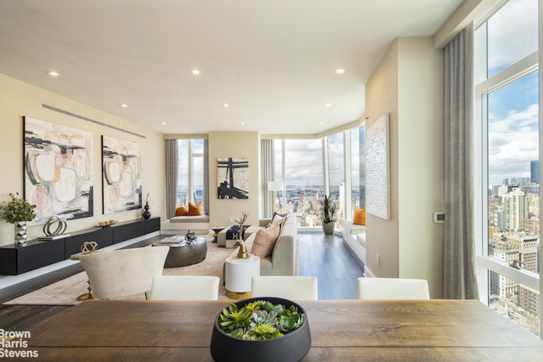 45 East 22nd Street, Unit 42A Manhattan, NY 10010 - Photo 5 of 23 a living room with furniture and a large window