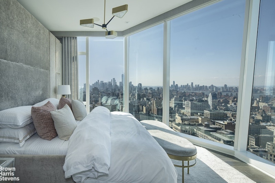 45 East 22nd Street, Unit 42A Manhattan, NY 10010 - Photo 8 of 23 a large bedroom with a bed and a balcony