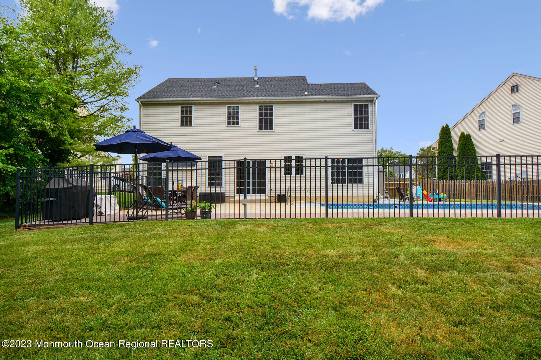 62 Gristmill Road Howell, NJ 07731 - Photo 25 of 29 a view of a house with a yard and sitting area