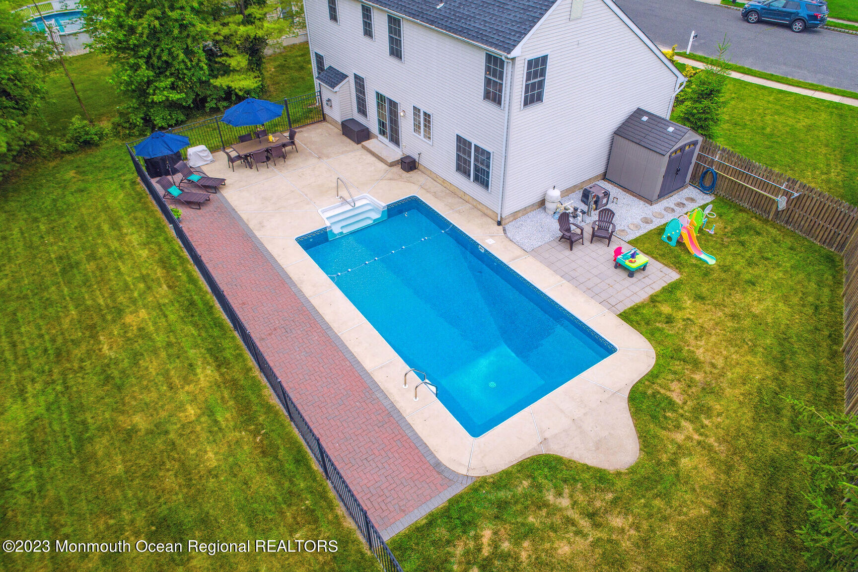 62 Gristmill Road Howell, NJ 07731 - Photo 27 of 29 a view of an house with swimming pool