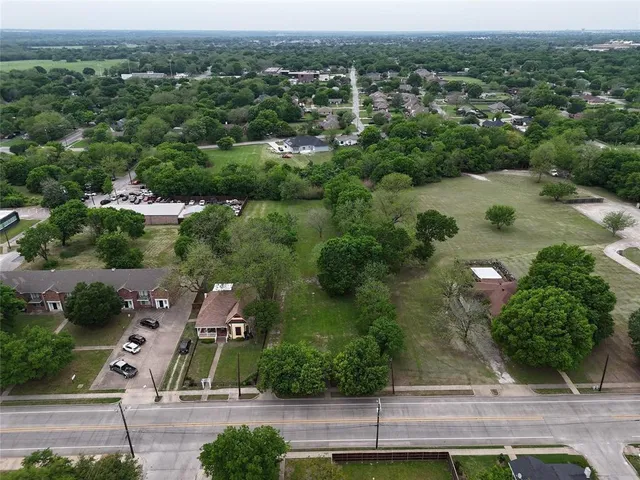 an aerial view of residential house with outdoor space